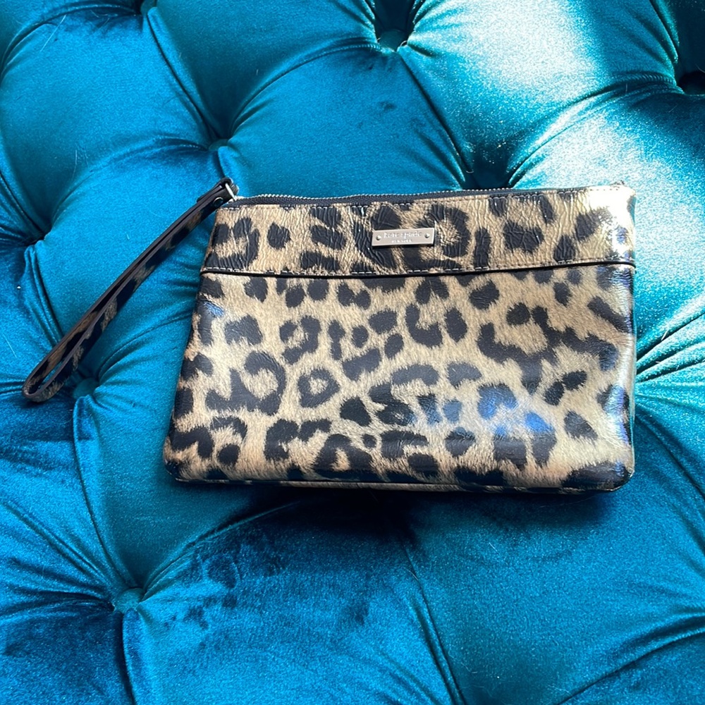 Kate Spade wristlet. Handled with care and stored in original box.